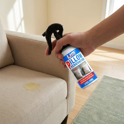 FreshAgain — Hand spraying FreshAgain bottle onto yellowed couch stain