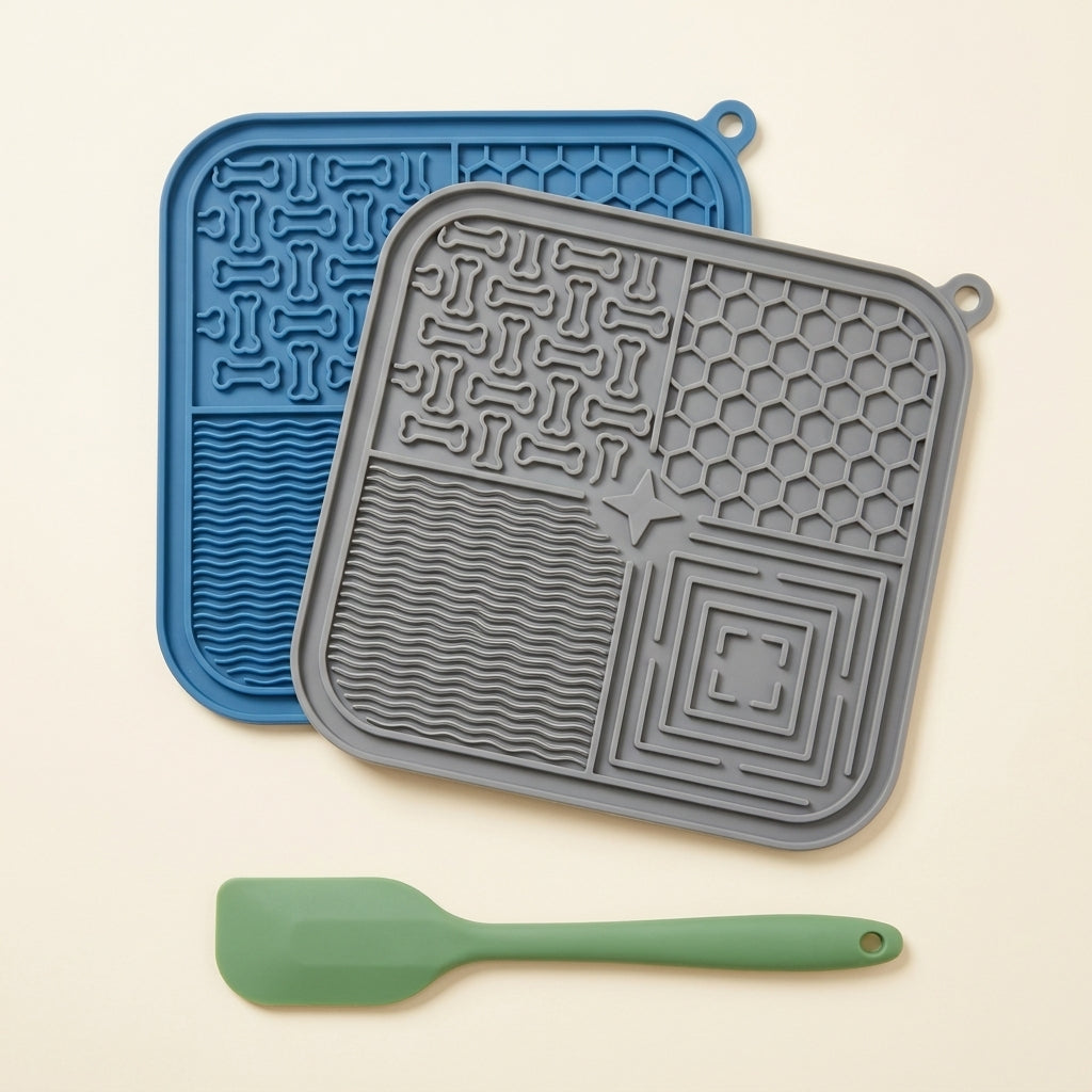Flat lay of grey and blue CalmLick lick mats with silicone spatula, everything included in the set