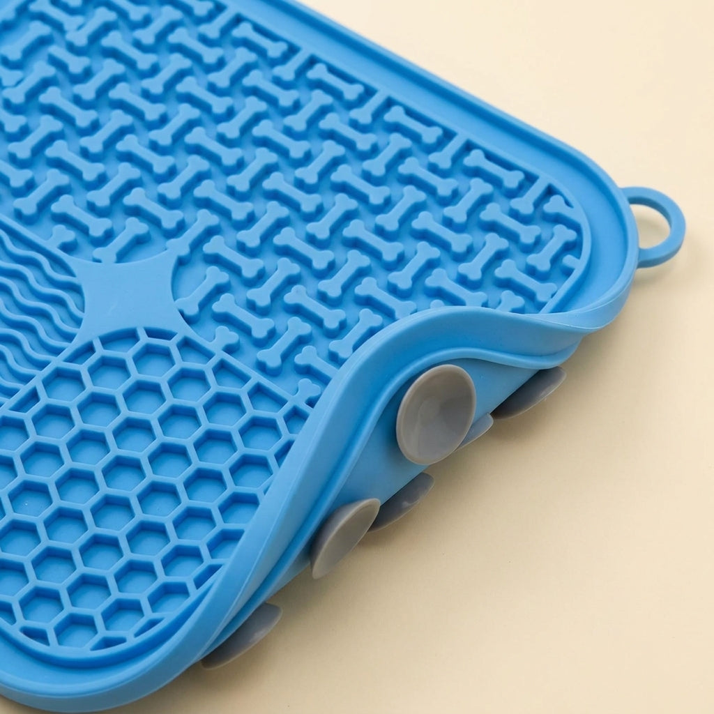 Close-up detail of the four textured quadrants and suction-cup base of the silicone lick mat