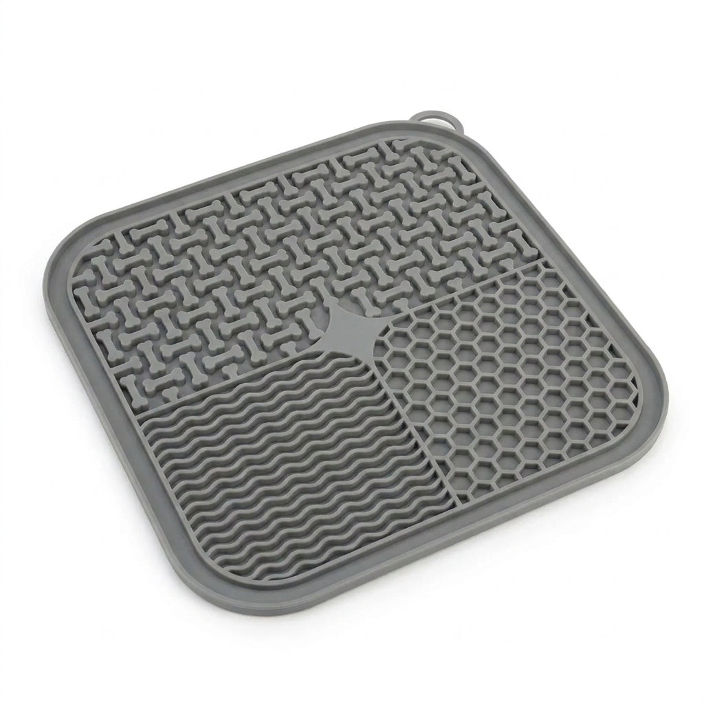 Clean studio product shot of a single grey CalmLick silicone slow-feeder lick mat